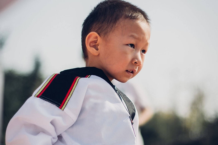 Focused kid - cost of martial arts classes for kids is worth it