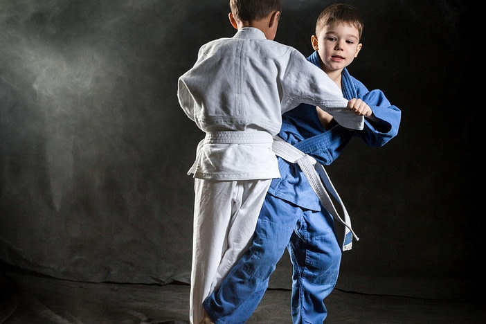 Two boys training in Judo one of the best martial arts for kids